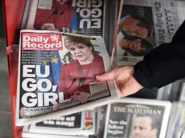 A man takes a copy of the Daily Record newspaper reporting on the pro-Brexit result of the UK's EU referendum vote and with an image of Scotland's First Minister, Nicola Sturgeon. (AFP Photo) A man takes a copy of the Daily Record newspaper reporting on the pro-Brexit result of the UK's EU referendum vote and with an image of Scotland's First Minister, Nicola Sturgeon. (AFP Photo)