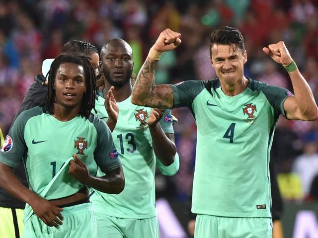 Portugal's Renato Sanches (L), Danilo Pereira (C) and Fonte celebrate their team’s victory. (AFP)