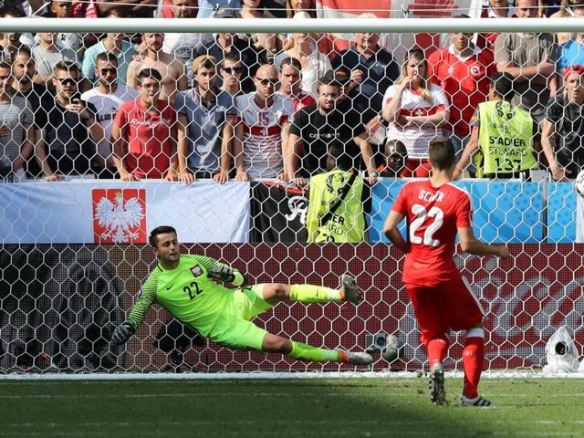 Switzerland's Fabian Schaer scores on a penalty shootout. (AP Photo)