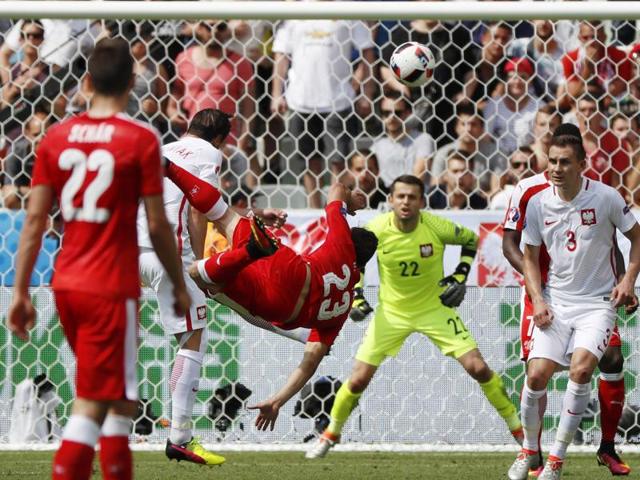 Switzerland's Xherdan Shaqiri scores his side's first goal during the Euro 2016. (AP Photo)