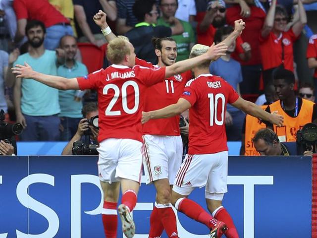 From left, Wales's Jonathan Williams, Wales's Gareth Bale and Wales's Aaron Ramsey celebrate. (AP photo)