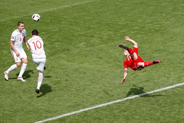 Xherdan Shaqiri equalises for Switzerland with a spectacular bicycle kick. (REUTERS) Xherdan Shaqiri equalises for Switzerland with a spectacular bicycle kick. (REUTERS)
