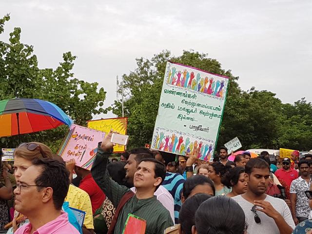 An activist holds up a sign with an excerpt from a poem by Tamil poet Bharathiyar. “The colour of one’s skin may be different, but there is no difference between humans.” (Aditya Iyer/HT) An activist holds up a sign with an excerpt from a poem by Tamil poet Bharathiyar. “The colour of one’s skin may be different, but there is no difference between humans.” (Aditya Iyer/HT)