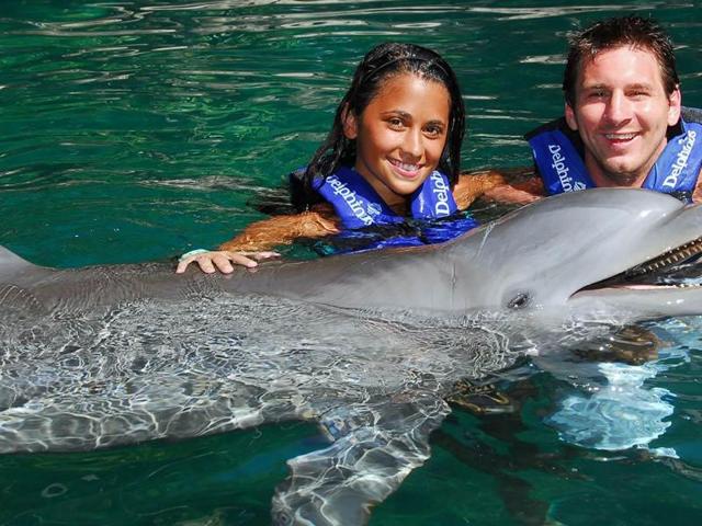 Lionel Messi and girlfriend Antonella Rocuzzo swim with dolphins at the Delphinus aquarium on July 24, 2010 in Playa del Carmen, Mexico. (AP Photo) Lionel Messi and girlfriend Antonella Rocuzzo swim with dolphins at the Delphinus aquarium on July 24, 2010 in Playa del Carmen, Mexico. (AP Photo)