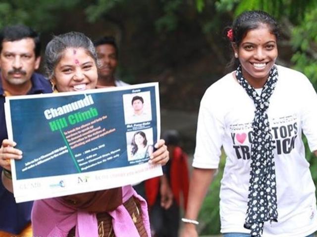 Activists going up Chamundi Hills in Mysuru hold up a poster during the first ‘Climb Against Sexual Abuse’ campaign in India. Rape survivors across 17 countries are using mountains as a metaphor to inspire others to overcome the odds and speak out.(Photos by Flashbulbzz Photography)