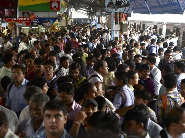 A sea of people wait for trains at Dadar station after a few services were cancelled because of heavy rain. (Arijit Sen)