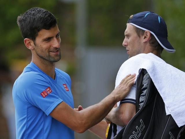 Novak Djokovic, left, greets Italy's Andreas Seppi as he arrives for a training session. (AP) Novak Djokovic, left, greets Italy's Andreas Seppi as he arrives for a training session. (AP)