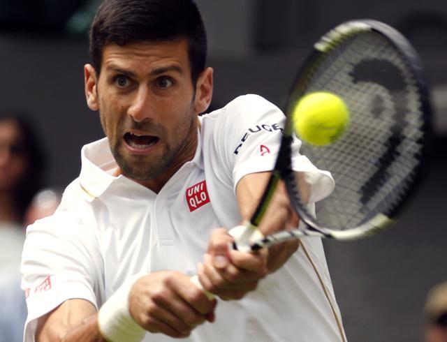 Novak Djokovic of Serbia plays a return to Jamie Ward of Britain. (AP Photo) Novak Djokovic of Serbia plays a return to Jamie Ward of Britain. (AP Photo)