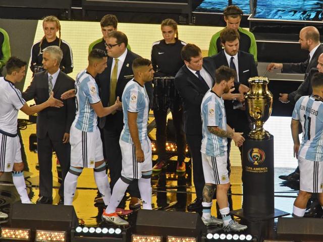 Argentine players receive their second-place medals during the awards ceremony. (AFP)