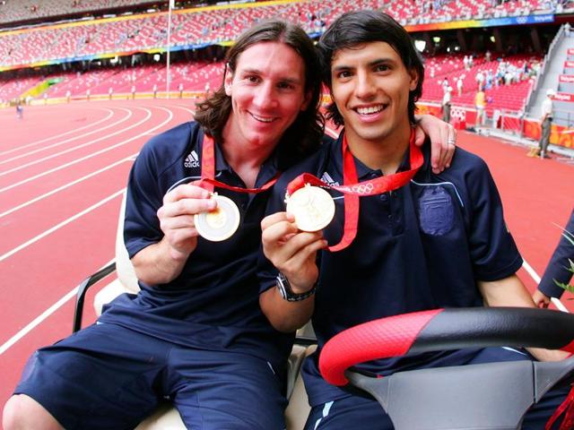 Argentinian forwards Lionel Messi (L) and Sergio Aguero gold medal pose during the men's Olympic football tournament medal ceremony at the national stadium in Beijing during the Men's Final between Nigeria and Argentina at the National Stadium on Day 15 of the Beijing 2008 Olympic Games. (Getty Images) Argentinian forwards Lionel Messi (L) and Sergio Aguero gold medal pose during the men's Olympic football tournament medal ceremony at the national stadium in Beijing during the Men's Final between Nigeria and Argentina at the National Stadium on Day 15 of the Beijing 2008 Olympic Games. (Getty Images)