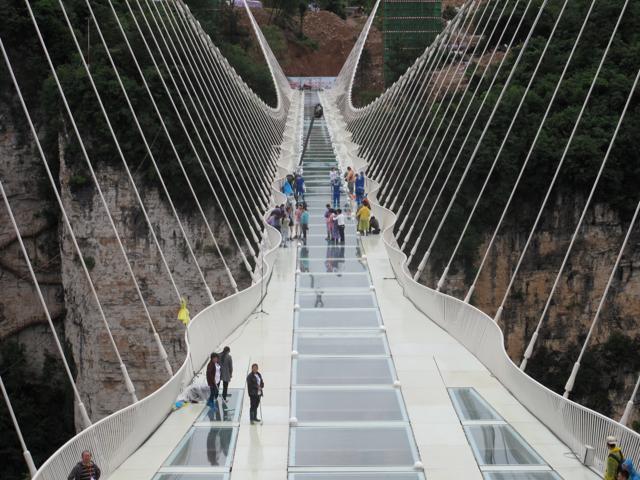 People wait for a safety test ceremony of the glass-bottom bridge. (REUTERS) People wait for a safety test ceremony of the glass-bottom bridge. (REUTERS)