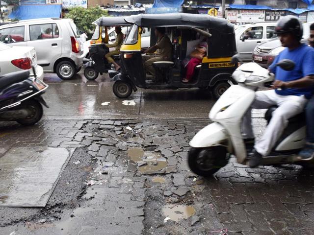 The city isn’t ready for the monsoon as potholes show up across Mumbai. The crevices pose a major threat to commuters who have to dodge the cracks amid heavy showers. (Vidya Subramanian)
