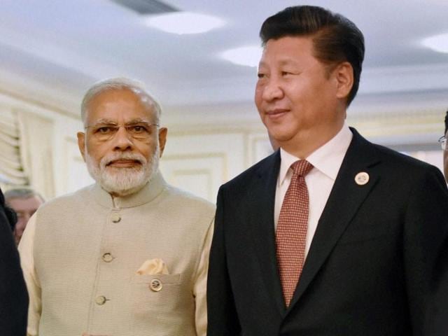 Prime Minister Narendra Modi with Chinese President Xi Jinping in Tashkent.(PTI Photo)