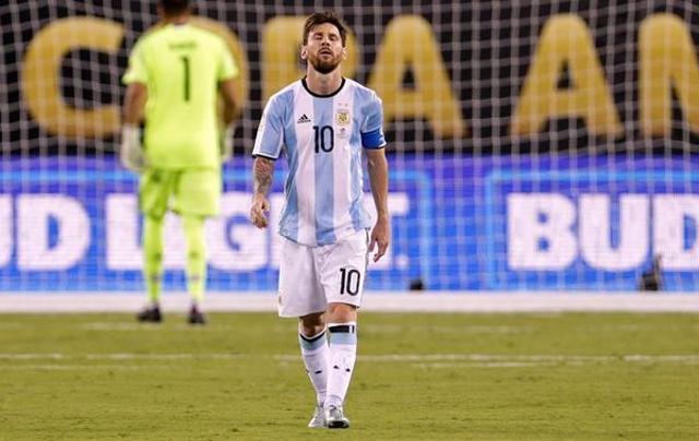 Argentina midfielder Lionel Messi reacts after missing a shot during the shoot out round against Chile. (AFP Photo) Argentina midfielder Lionel Messi reacts after missing a shot during the shoot out round against Chile. (AFP Photo)