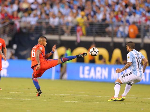 Chile midfielder Arturo Vidal (8) kicks the ball. (Reuters)