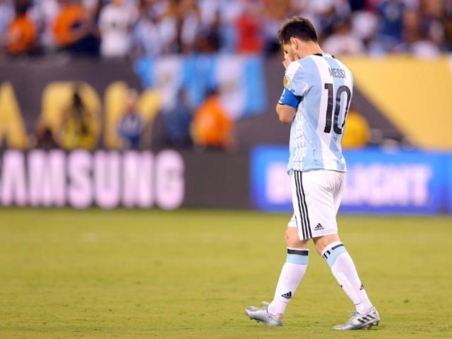 Messi buries his face in his hands after missing a penalty. (Reuters)