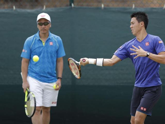 Japan's Kei Nishikori (R) plays a shot during a practice session, overseen by Michael Chang. (AFP) Japan's Kei Nishikori (R) plays a shot during a practice session, overseen by Michael Chang. (AFP)