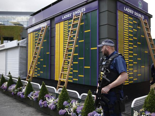 An armed police officer stands guard next to a board displaying the draw. (AFP) An armed police officer stands guard next to a board displaying the draw. (AFP)