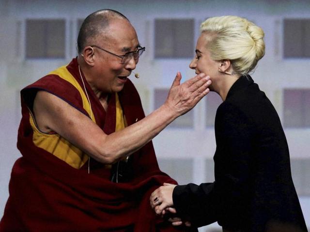 The Dalai Lama and singer Lady Gaga appear together for a question and answer session on "the global significance of building compassionate cities" at the US Conference of Mayors in Indianapolis on Sunday. (Reuters) The Dalai Lama and singer Lady Gaga appear together for a question and answer session on "the global significance of building compassionate cities" at the US Conference of Mayors in Indianapolis on Sunday. (Reuters)