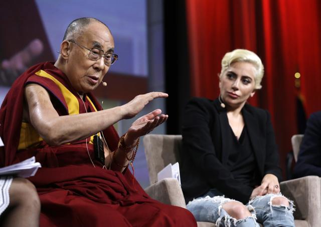 Lady Gaga listens as the Dalai Lama speaks during a question and answer session at the US Conference of Mayors in Indianapolis on Sunday. (AP) Lady Gaga listens as the Dalai Lama speaks during a question and answer session at the US Conference of Mayors in Indianapolis on Sunday. (AP)