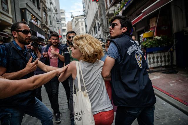 Riot police officers detain a LGBT demonstrator during the rally. (AFP) Riot police officers detain a LGBT demonstrator during the rally. (AFP)
