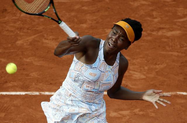 FILE - In this May 28, 2016 file photo, Venus Williams of the U.S returns the ball to France's Alize Cornet during their third round match of the French Open tennis tournament at the Roland Garros stadium in Paris. (AP Photo/Alastair Grant, File) (AP) FILE - In this May 28, 2016 file photo, Venus Williams of the U.S returns the ball to France's Alize Cornet during their third round match of the French Open tennis tournament at the Roland Garros stadium in Paris. (AP Photo/Alastair Grant, File) (AP)