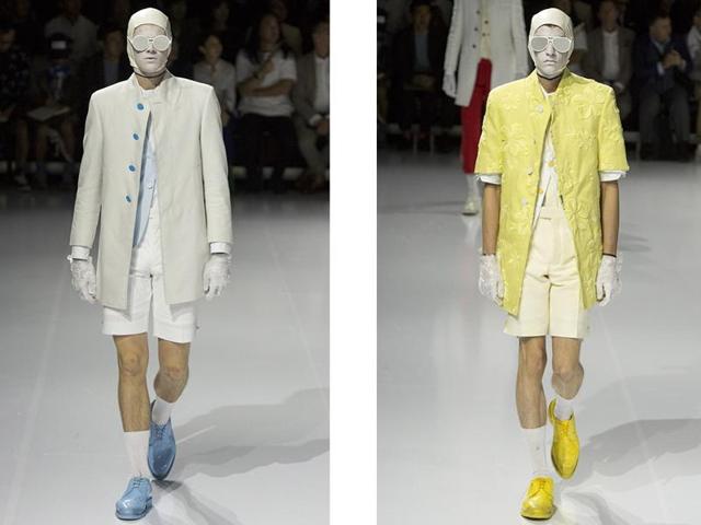 No man is an island, unless of course he’s the man tasked with sitting patiently against a palm tree while guests entered the space for Browne’s Spring 2017 show. Dressed in a gray Thom Browne suit, white face mask, and gloves, a model got up and began tweaking the outfits of other models in the show.