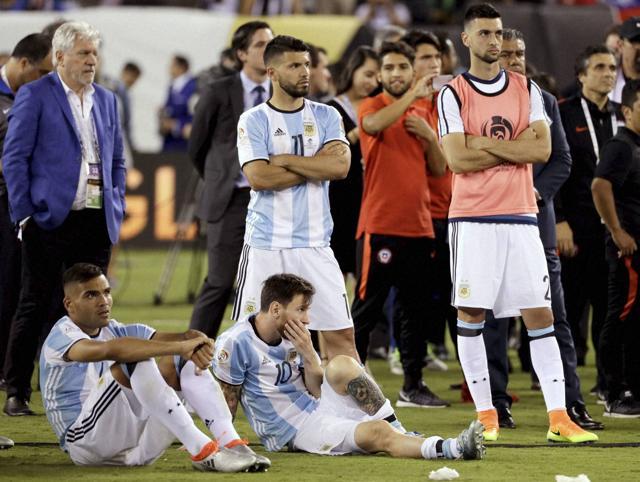 A disappointed Argentina team after their loss to Chile. (AP)