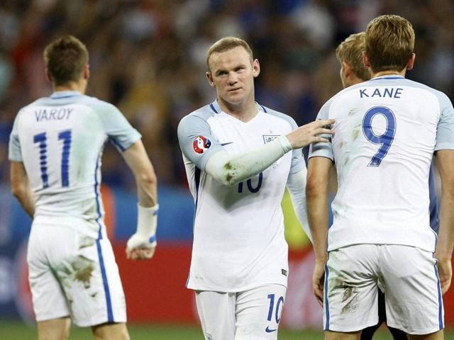 England's Wayne Rooney comforts his teammates at the end of their Euro run. (AP PHOTO)