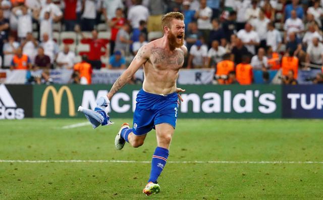 Iceland captain Aron Gunnarsson celebrates his nation’s historic win. (REUTERS)