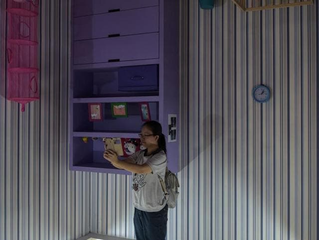 And another clicking selfies in a kids’ room. (AFP) And another clicking selfies in a kids’ room. (AFP)