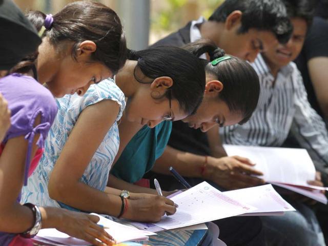 Students fill OMR forms for Delhi University admissions. 
