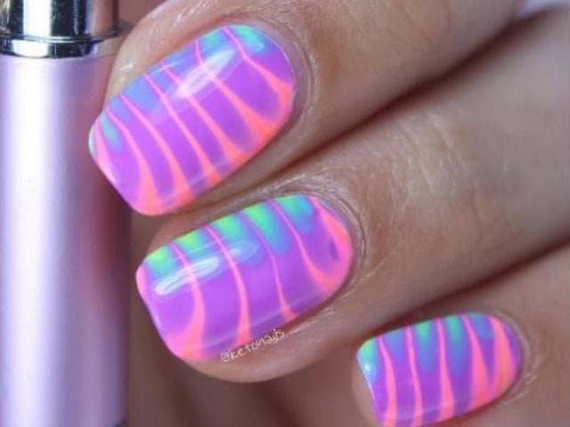 <p>A video tutorial from India showing the painstaking technique behind a water marble effect manicure has become popular on social media.</p><p>The effect is achieved when different coloured drops of nail polish are placed in a cup of water and an intricate pattern is made using a pointed object.</p><p>An elaborate pattern transfers onto the nail once it is dipped into the cup and excess polish is removed.</p><p>The uploader of the video is a Mumbai-based performer who practices nail art as a hobby.</p>