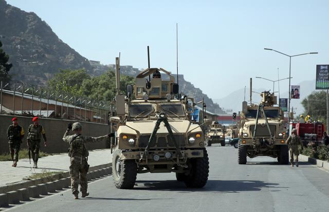 A US soldier directs his colleague at the site of a bomb attack that targeted several armoured vehicles belonging to forces attached to the Nato Resolute Support Mission in downtown of Kabul, Afghanistan (AP file photo) A US soldier directs his colleague at the site of a bomb attack that targeted several armoured vehicles belonging to forces attached to the Nato Resolute Support Mission in downtown of Kabul, Afghanistan (AP file photo)