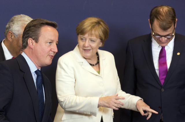 Cameron speaks with German Chancellor Angela Merkel at an EU summit in Brussels on Tuesday. (AP) Cameron speaks with German Chancellor Angela Merkel at an EU summit in Brussels on Tuesday. (AP)