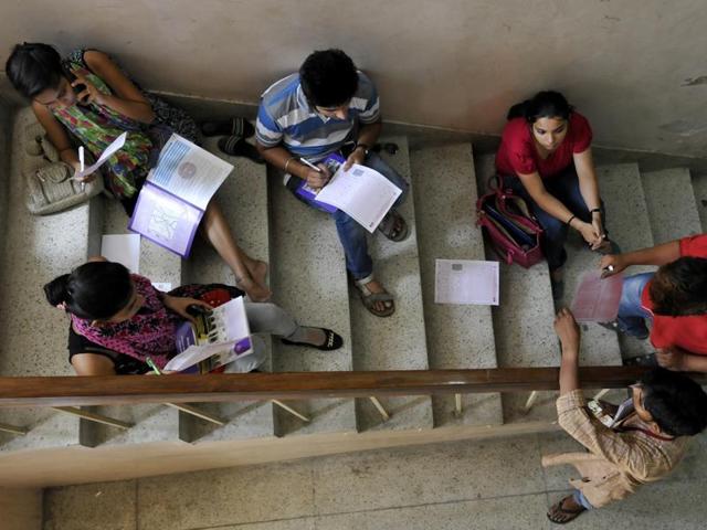 Students gather at Khalsa College under the Delhi University as the admission process begins. (Saumya Khandelwal/ HT Photo) Students gather at Khalsa College under the Delhi University as the admission process begins. (Saumya Khandelwal/ HT Photo)