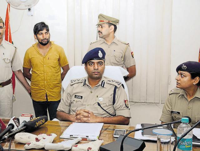 The accused (in yellow shirt) was arrested following a police raid in Shati Nagar Gate in Loni on late Monday night. (Sakib Ali /HT Photo) The accused (in yellow shirt) was arrested following a police raid in Shati Nagar Gate in Loni on late Monday night. (Sakib Ali /HT Photo)