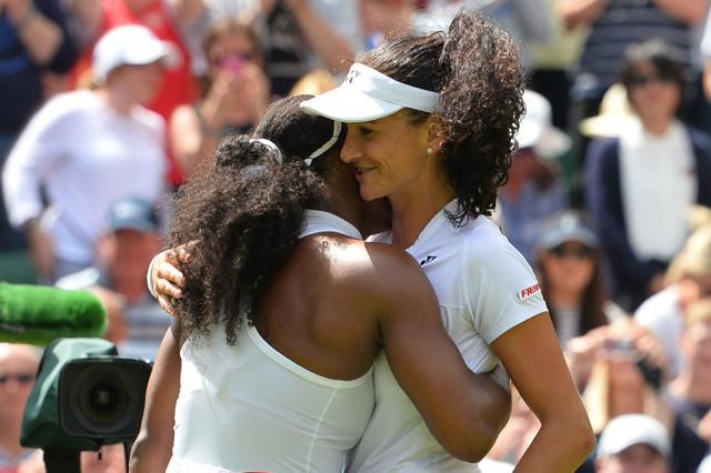 US player Serena Williams (left) and Switzerlands Amra Sadikovic (right) embrace at the net after Williams won their womens singles first round match on the second day of the 2016 Wimbledon Championships. (AFP Photo) US player Serena Williams (left) and Switzerlands Amra Sadikovic (right) embrace at the net after Williams won their womens singles first round match on the second day of the 2016 Wimbledon Championships. (AFP Photo)