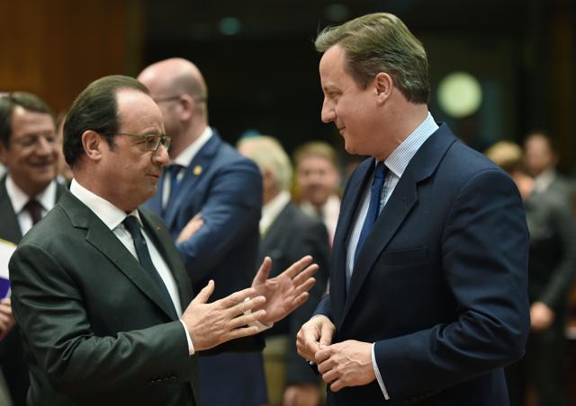 French President Francois Hollande (L) talks with Britain's Prime minister David Cameron during an EU summit meeting. (AFP) French President Francois Hollande (L) talks with Britain's Prime minister David Cameron during an EU summit meeting. (AFP)