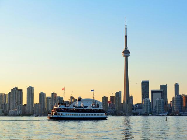 Toronto was ranked the second best place to visit in Canada for 2016. Toronto skyline in the day over lake with urban architecture and blue sky. (iStockphoto)