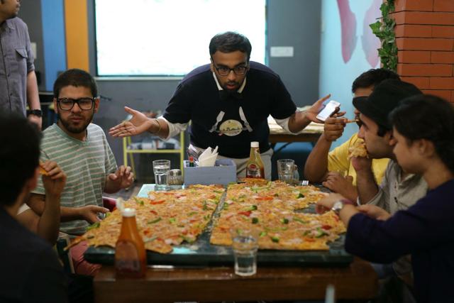 A pizza-eating competition in progress.
