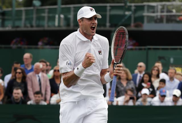 John Isner celebrates his win over Marcos Baghdatis. (AP) John Isner celebrates his win over Marcos Baghdatis. (AP)
