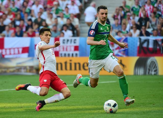 Poland's midfielder Bartosz Kapustka (left) attempts a tackle on Northern Ireland's defender Conor McLaughlin during the Euro 2016 group C football match between Poland and Northern Ireland at the Allianz Riviera stadium in Nice. (AFP Photo) Poland's midfielder Bartosz Kapustka (left) attempts a tackle on Northern Ireland's defender Conor McLaughlin during the Euro 2016 group C football match between Poland and Northern Ireland at the Allianz Riviera stadium in Nice. (AFP Photo)