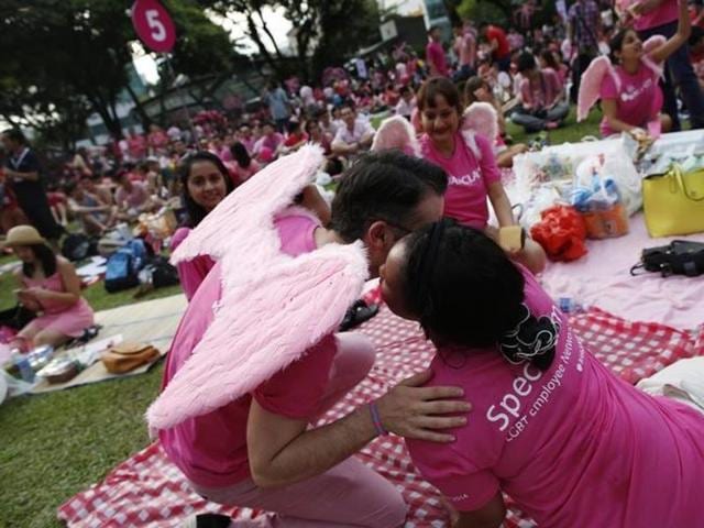 Participants dressed in pink embrace as they enjoy a picnic before taking part in the forming of a giant pink dot at the Speakers' Corner in Hong Lim Park in Singapore. (Reuters File) Participants dressed in pink embrace as they enjoy a picnic before taking part in the forming of a giant pink dot at the Speakers' Corner in Hong Lim Park in Singapore. (Reuters File)