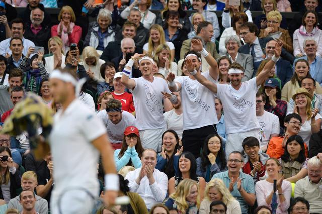 Fans of Britain's Marcus Willis celebrate in the crowd as Willis plays against Switzerland's Roger Federer in their men's singles second round match on the third day of the 2016 Wimbledon Championships at The All England Lawn Tennis Club in Wimbledon, southwest London. (AFP Photo) Fans of Britain's Marcus Willis celebrate in the crowd as Willis plays against Switzerland's Roger Federer in their men's singles second round match on the third day of the 2016 Wimbledon Championships at The All England Lawn Tennis Club in Wimbledon, southwest London. (AFP Photo)