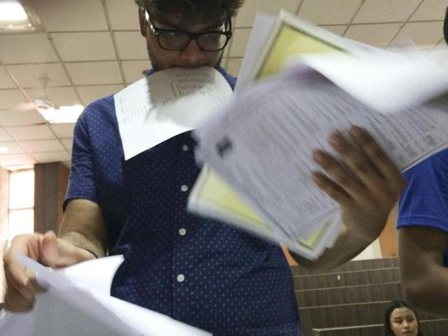 After the first cutoff list is released, hundreds of students are in a fix trying to make sense of the admission list. Here’s one getting baffled with all the forms at the Sri Venkateshwar College in New Delhi on Thursday. (Saumya Khandelwal/ HT Photo)