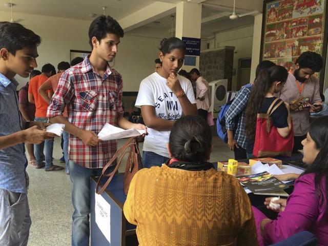 Students at the admission counters. You may not get the course or college of your choice, but not taking admission in the first list and waiting for the second list is a risk not worth taking. (Saumya Khandelwal / HT Photo)