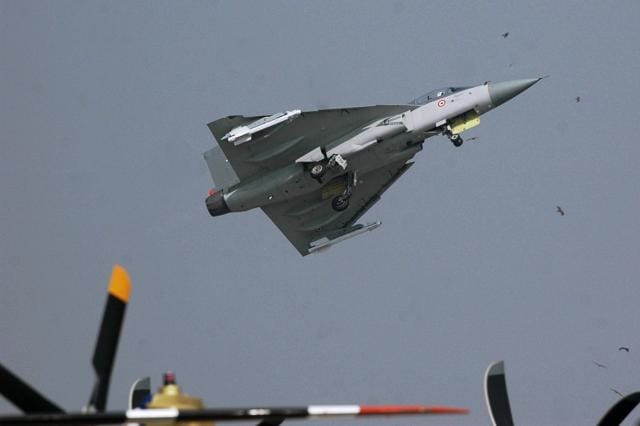 The LCA aircraft Tejas showing its manoeuvres during the inaugural flight during the Aero India 2009 show at Yelahanka Air Base in Bangalore on Saturday. (PTI File Photo) The LCA aircraft Tejas showing its manoeuvres during the inaugural flight during the Aero India 2009 show at Yelahanka Air Base in Bangalore on Saturday. (PTI File Photo)