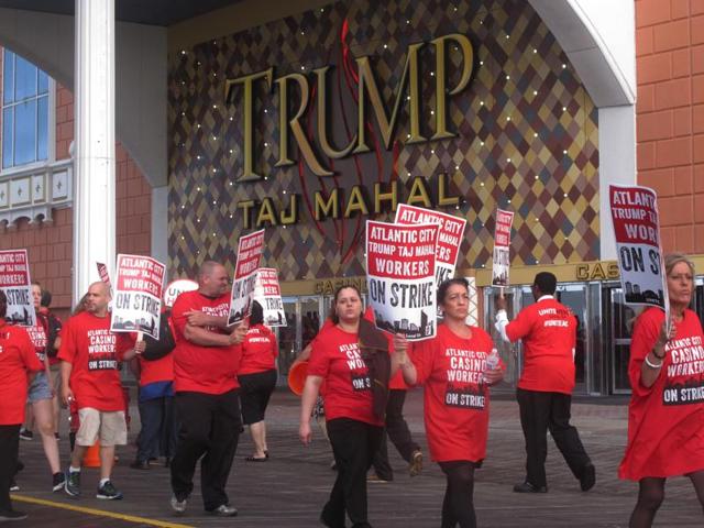 Striking union members walk a picket line outside the Trump Taj Mahal casino in Atlantic City on Friday. (AP Photo) Striking union members walk a picket line outside the Trump Taj Mahal casino in Atlantic City on Friday. (AP Photo)