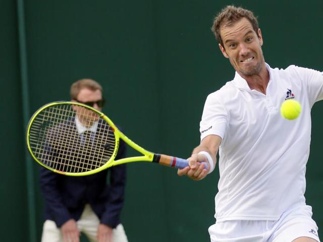 Richard Gasquet of France returns to Marcel Granollers of Spain during their men's singles match on day four of the Wimbledon Tennis Championships in London. (AP Photo) 